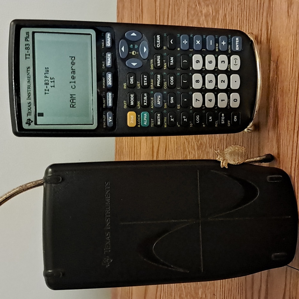 Texas Instruments TI-83 Plus Graphing Calculator - Black and Blue